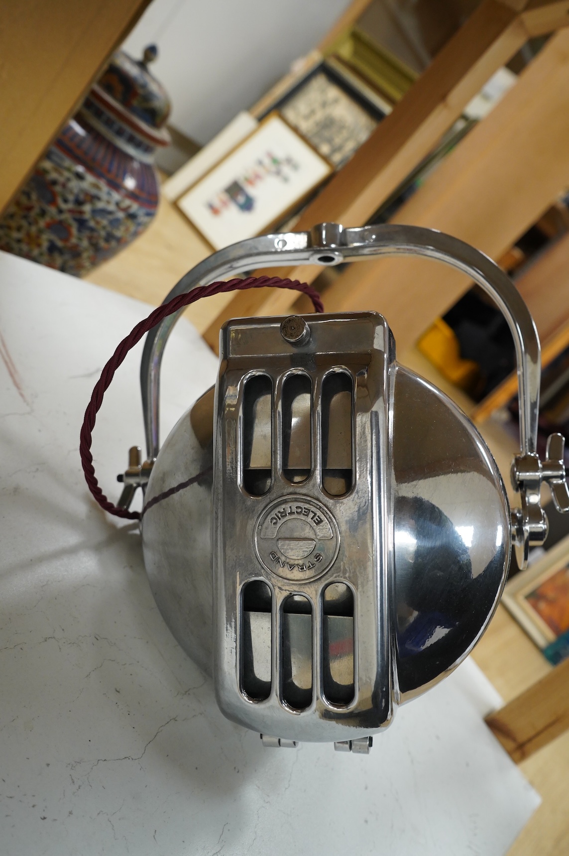 A vintage Strand electric chrome theatre lamp